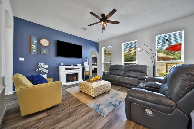 a living room with furniture and a flat screen tv
