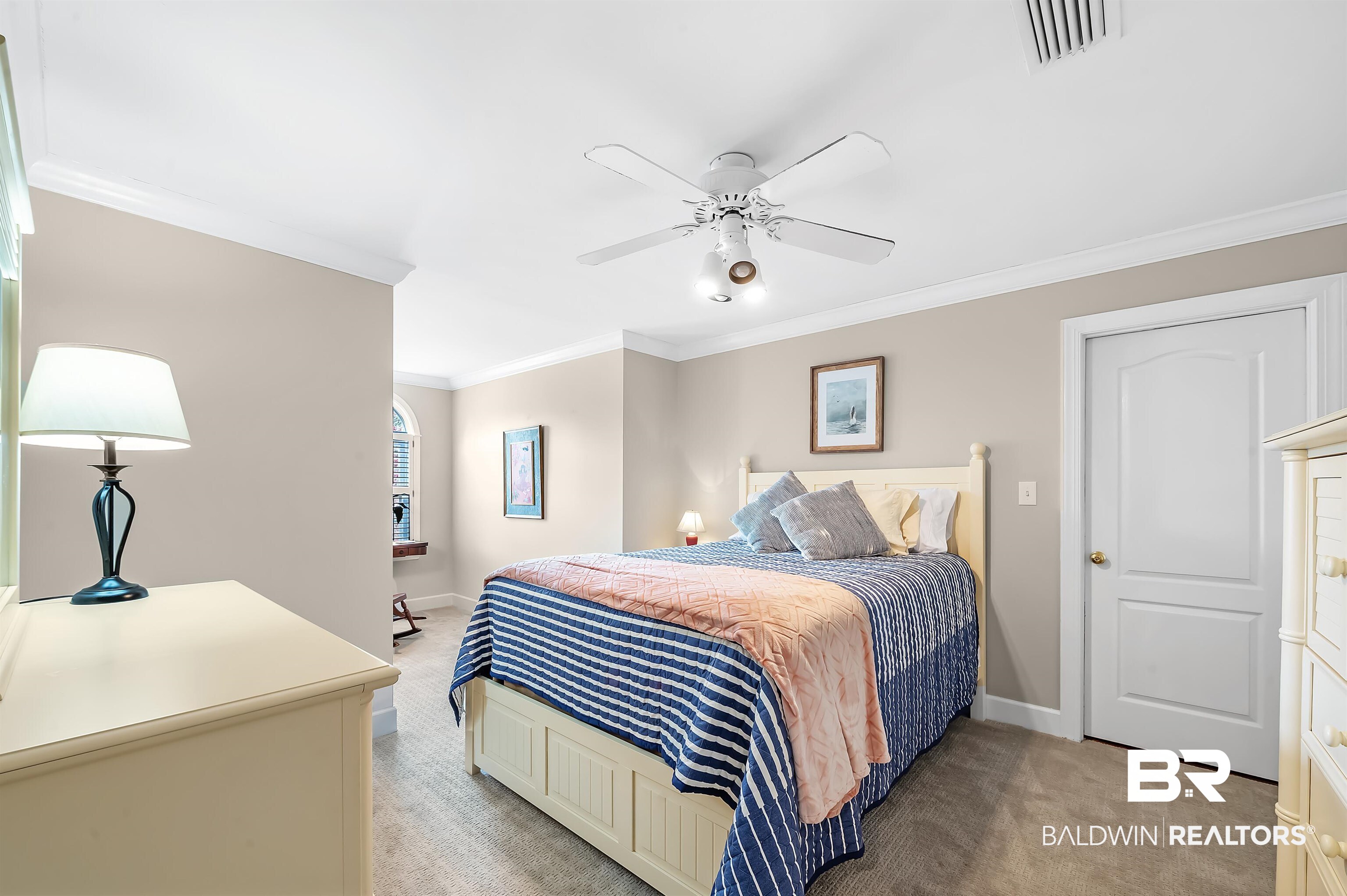 8915 Bay Point Drive Elberta, AL 36530 - Photo 62 of 74 Bedroom featuring light carpet, baseboards, visible vents, and crown molding