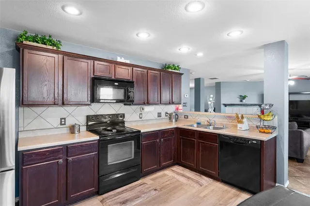 a kitchen with a stove and a sink