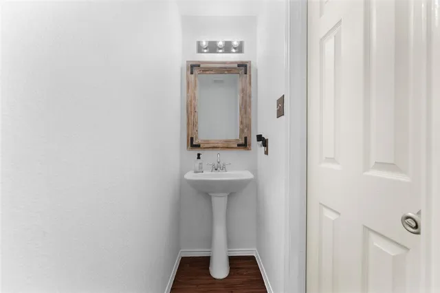 a bathroom with a sink a mirror and a shower