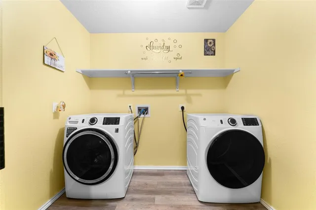 a utility room with dryer and washer