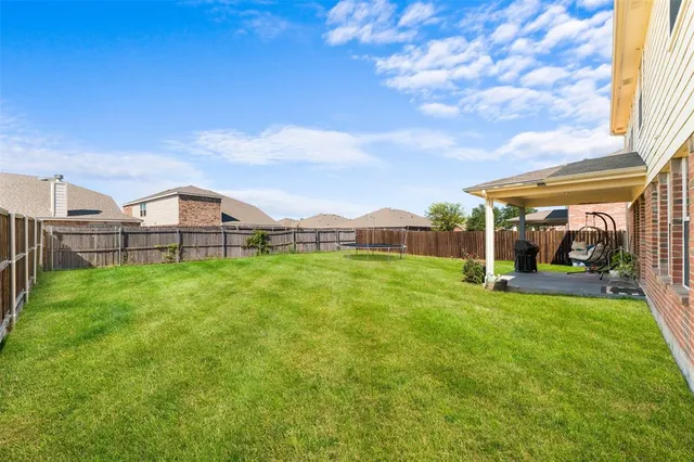 a view of a house with a big yard