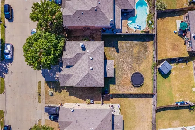 an aerial view of residential house with outdoor space