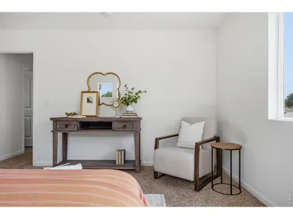 a bedroom with a bed and a table