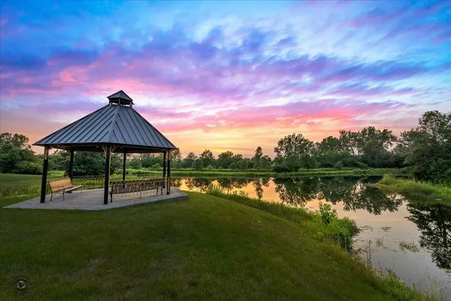a view of a lake with a yard