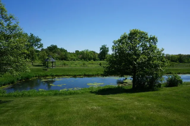 a view of outdoor space with deck and yard
