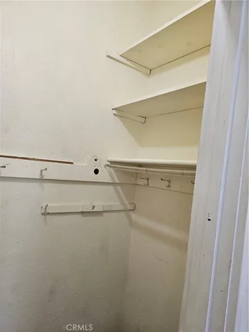 a view of a room with racks on the wall