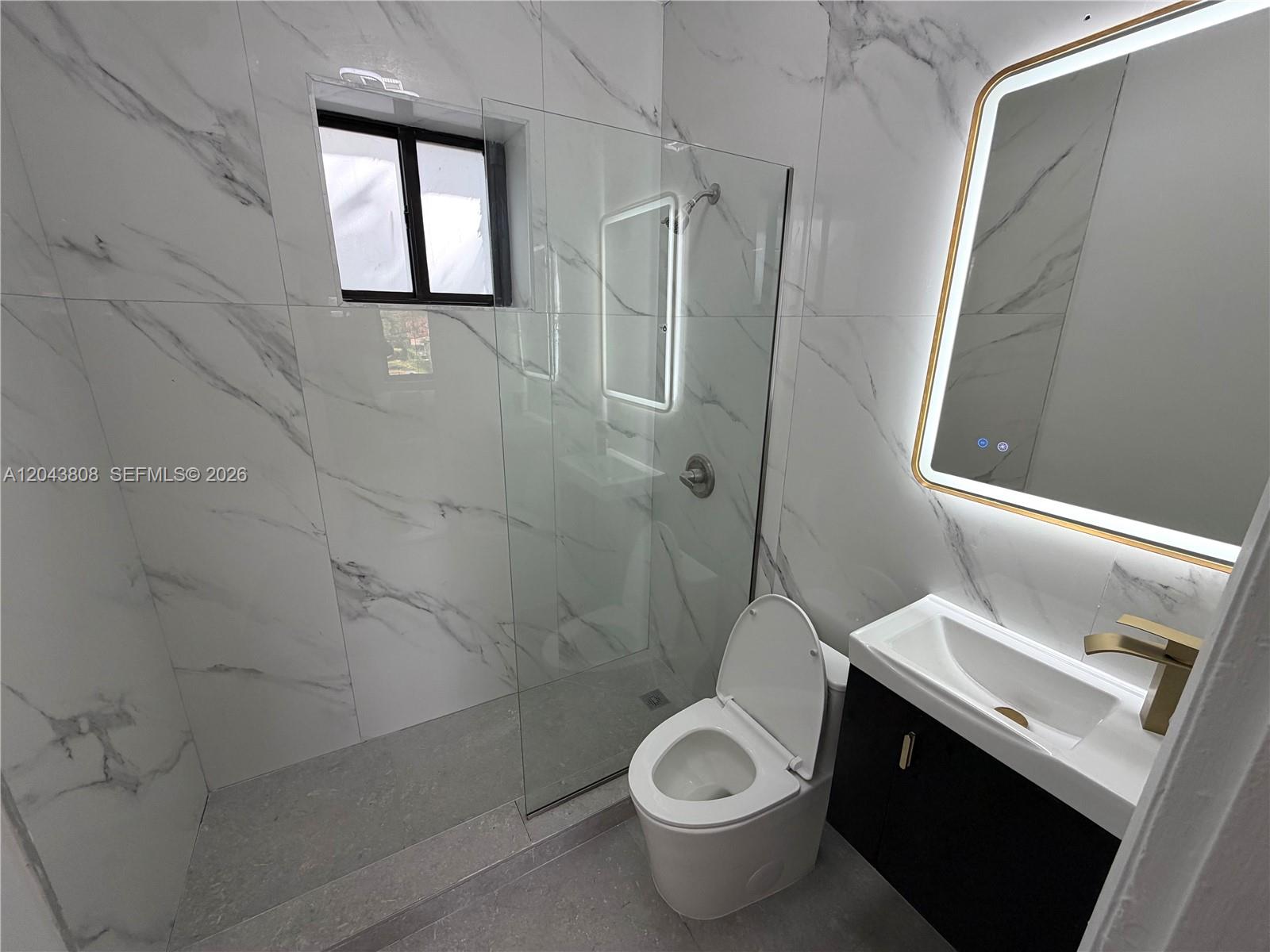 2134 Southwest 11th Street Miami, FL 33135 - Photo 12 of 13 a bathroom with a sink toilet and shower