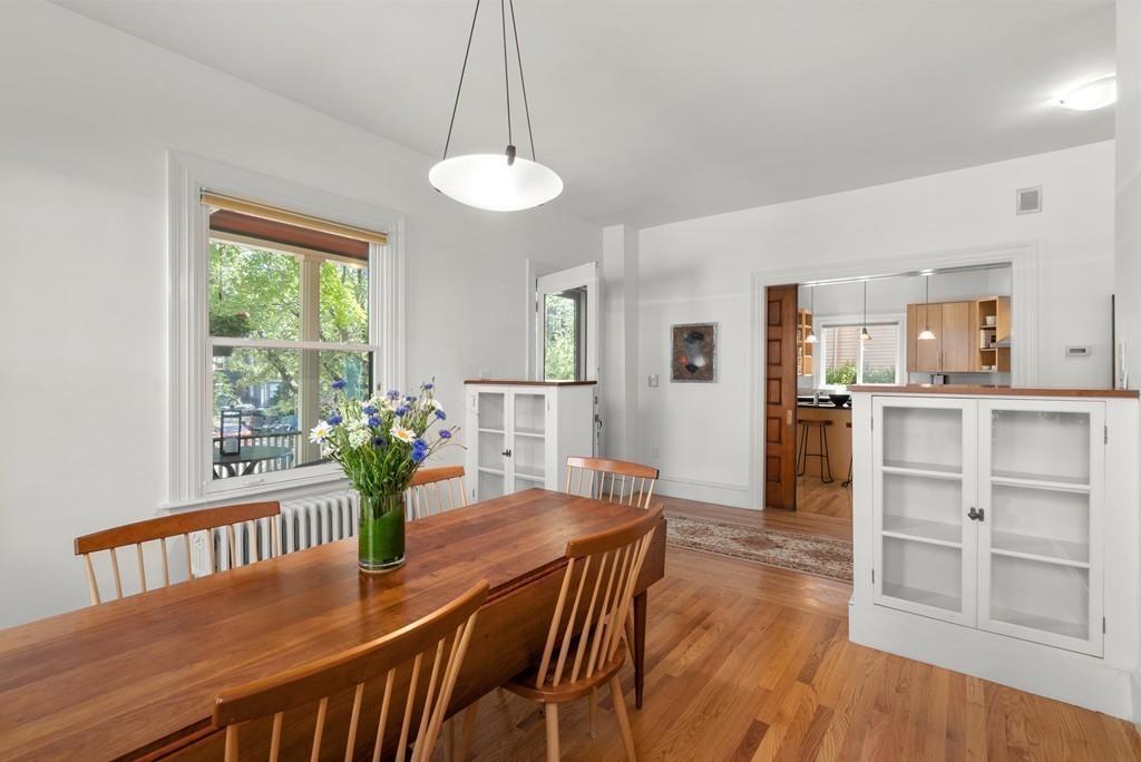 182 Upland Road Cambridge, MA 02140 - Photo 11 of 30 a view of a dining room with furniture window and wooden floor