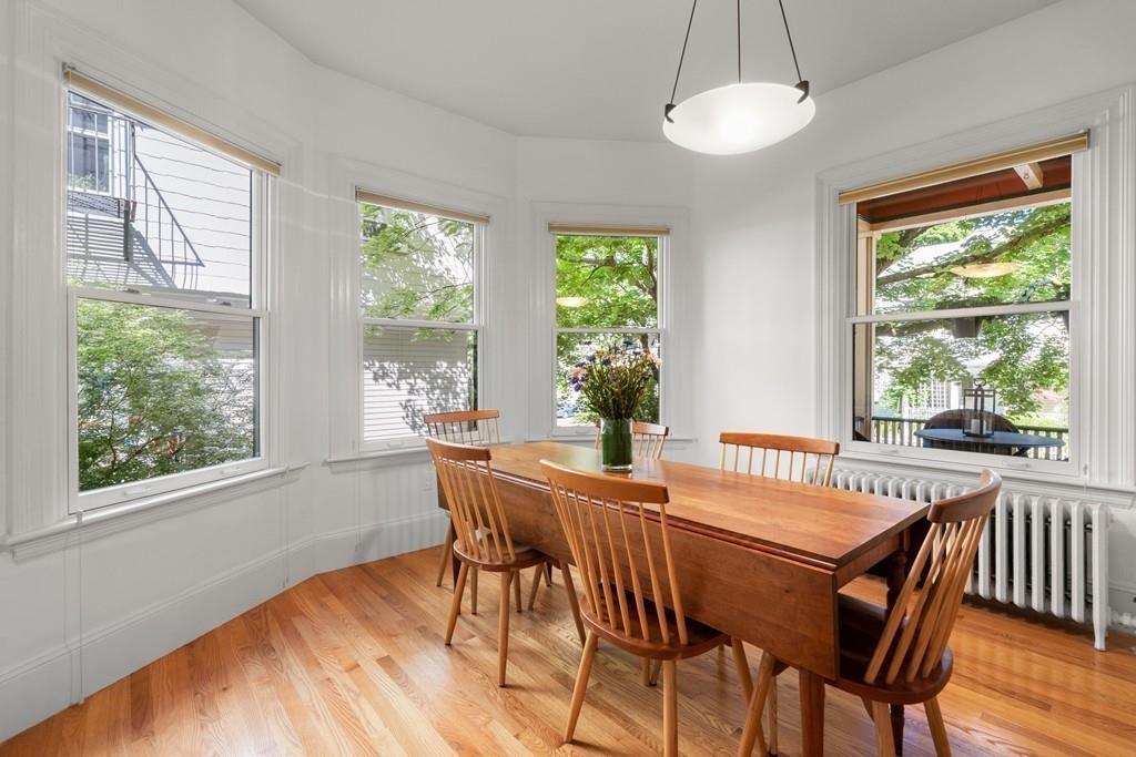182 Upland Road Cambridge, MA 02140 - Photo 12 of 30 a view of a dining room with furniture window and outside view