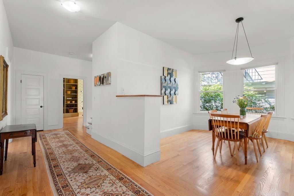 182 Upland Road Cambridge, MA 02140 - Photo 13 of 30 a view of a dining room with furniture window and wooden floor
