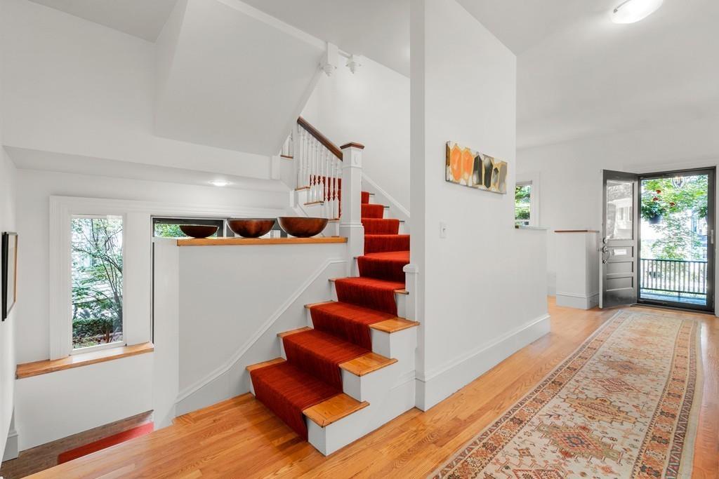 182 Upland Road Cambridge, MA 02140 - Photo 15 of 30 a view of entryway and hall with wooden floor