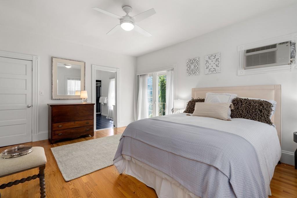 182 Upland Road Cambridge, MA 02140 - Photo 16 of 30 a bedroom with a bed and a television