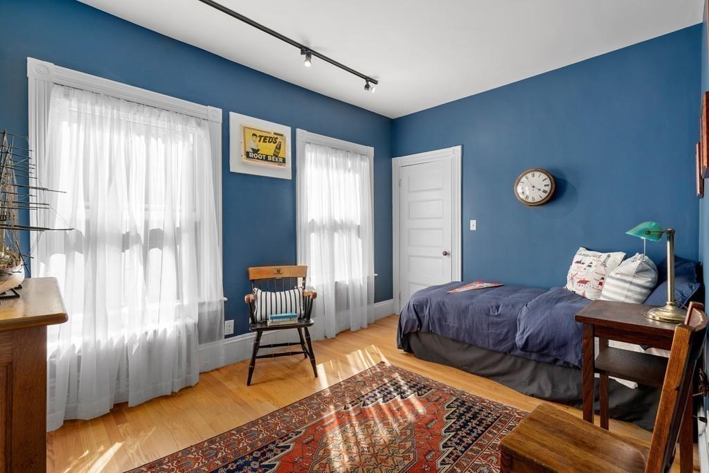 182 Upland Road Cambridge, MA 02140 - Photo 19 of 30 a bedroom with furniture and a window