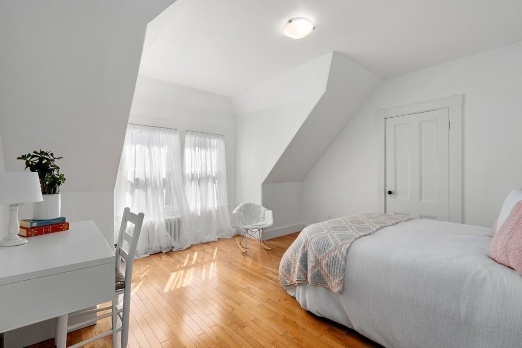 182 Upland Road Cambridge, MA 02140 - Photo 24 of 30 a bedroom with a bed and a window