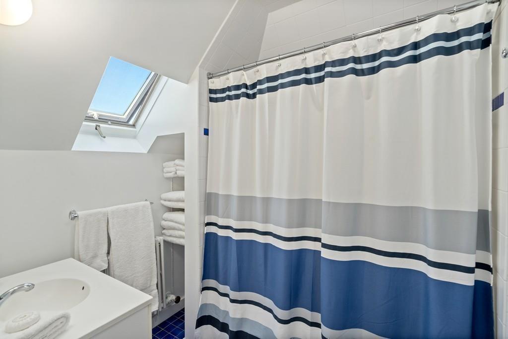 182 Upland Road Cambridge, MA 02140 - Photo 26 of 30 a bathroom with a sink and a mirror