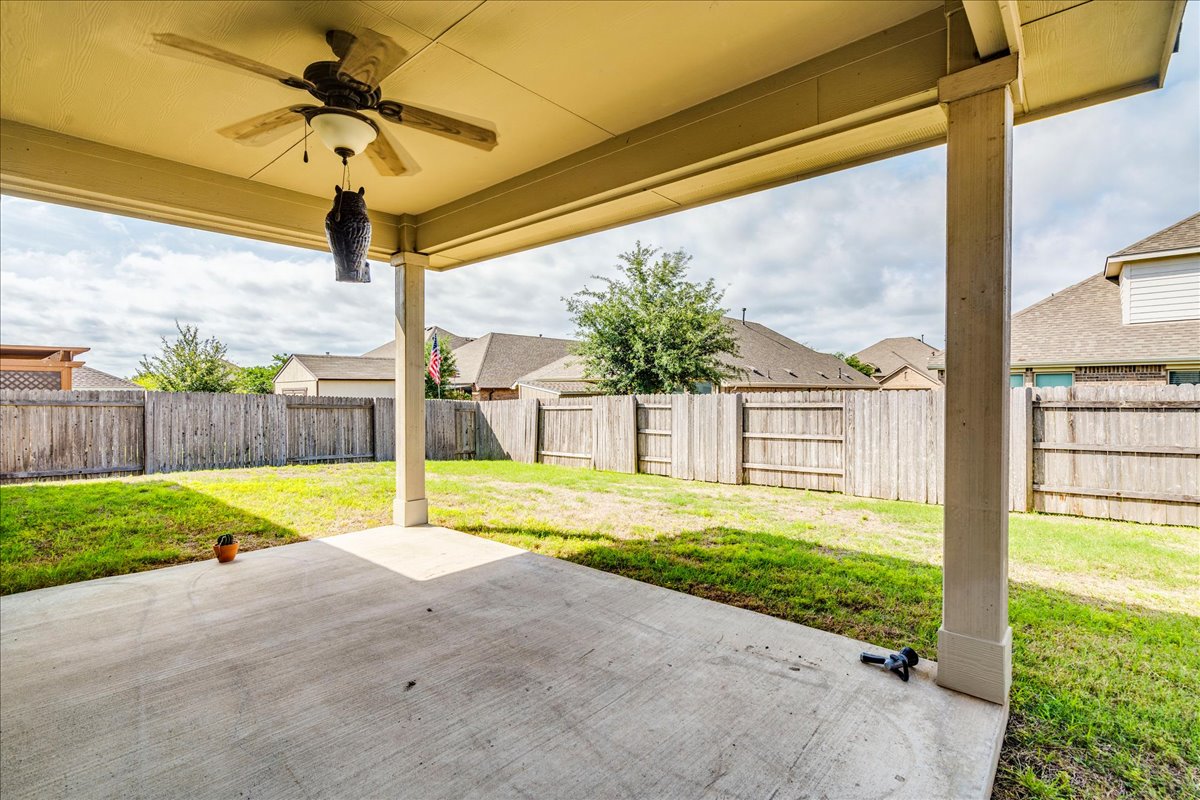 124 Compass Lane Kyle, TX 78640 - Photo 30 of 38 a view of swimming pool with a yard