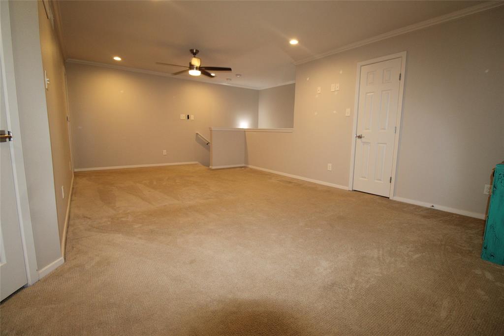 14333 Preston Road, Unit 1304 Dallas, TX 75254 - Photo 24 of 40 an empty room with a ceiling fan and a window