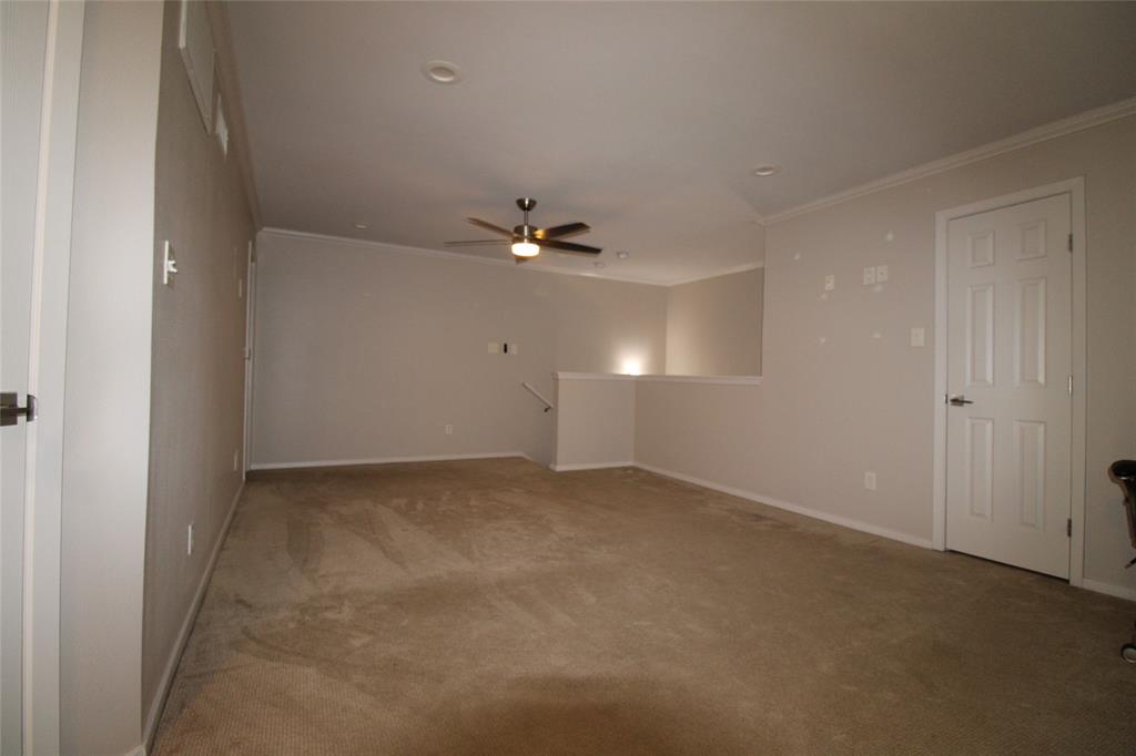 14333 Preston Road, Unit 1304 Dallas, TX 75254 - Photo 25 of 40 a view of an empty room with a ceiling fan