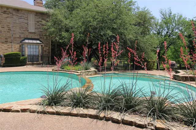 a view of a swimming pool with a patio