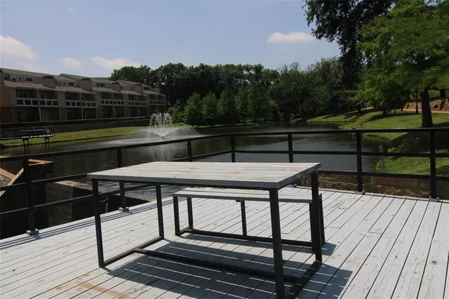 a view of a terrace with wooden floor and outdoor seating