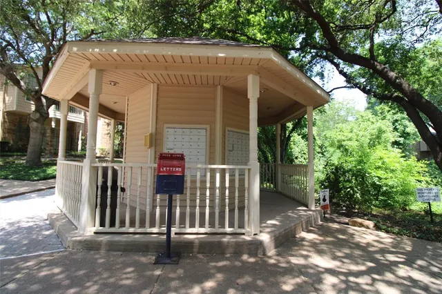 a view of a house with a small yard