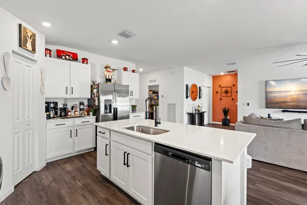 a view of a dining room with furniture and wooden floor