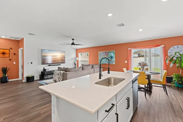 a dining room with furniture and wooden floor