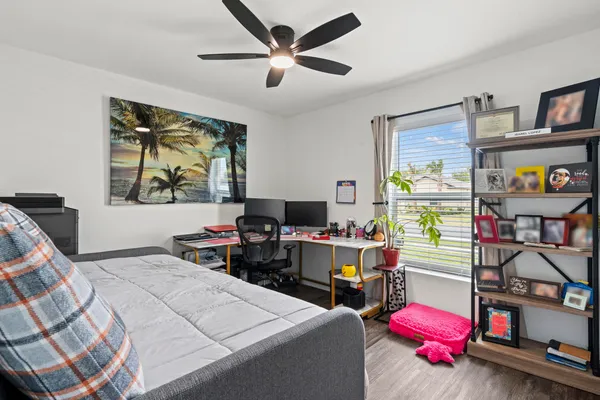 a bedroom with a bed and a sink