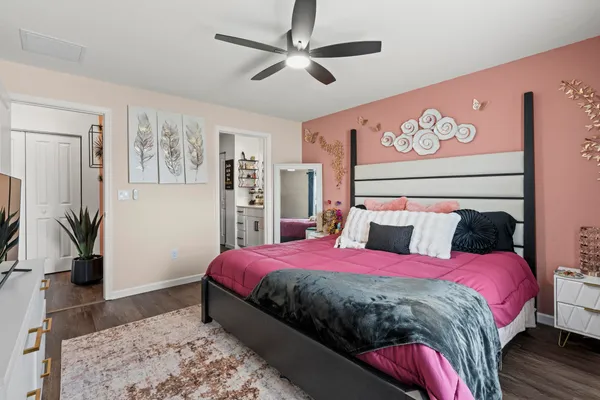 a view of walk in closet with clothes