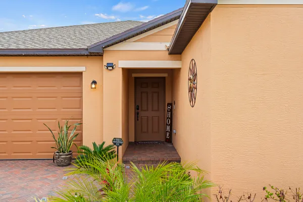 a front view of a house with a garage