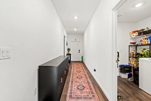 view of hallway with wooden floor