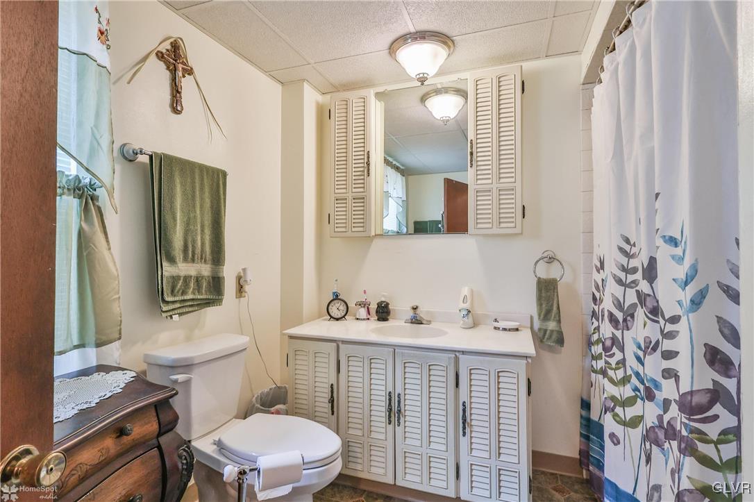 634 Spring Street Bethlehem, PA 18018 - Photo 27 of 48 a bathroom with a sink a toilet and mirror