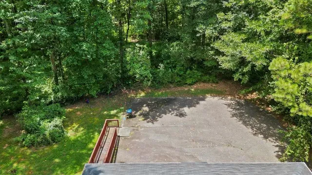 a view of a backyard with a tree