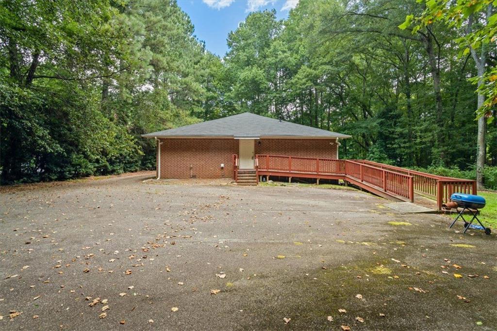 475 Newton Bridge Road Athens, GA 30607 - Photo 17 of 44 a house with trees in the background