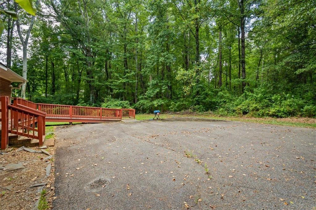 475 Newton Bridge Road Athens, GA 30607 - Photo 19 of 44 a backyard of a house with trees and plants