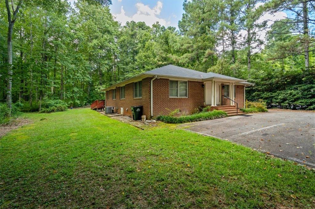 475 Newton Bridge Road Athens, GA 30607 - Photo 21 of 44 a front view of house with yard and green space