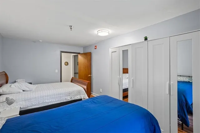 a bedroom with a bed and window