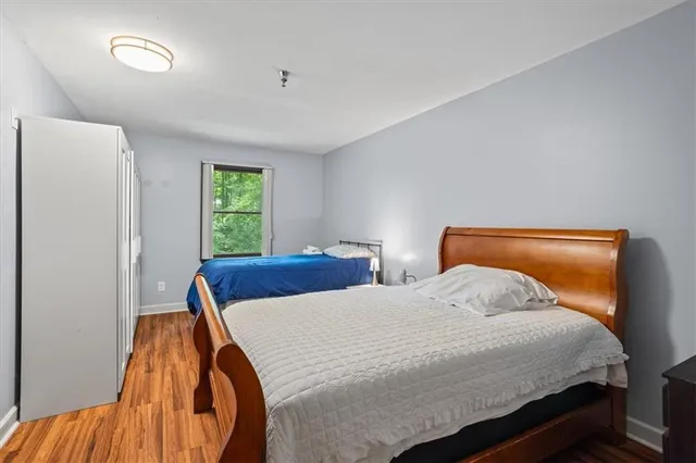 a bedroom with a bed and a table in it