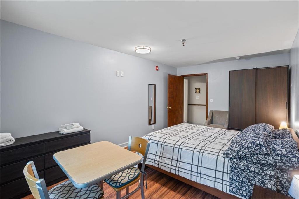 475 Newton Bridge Road Athens, GA 30607 - Photo 25 of 44 a bedroom with a bed and a table in it