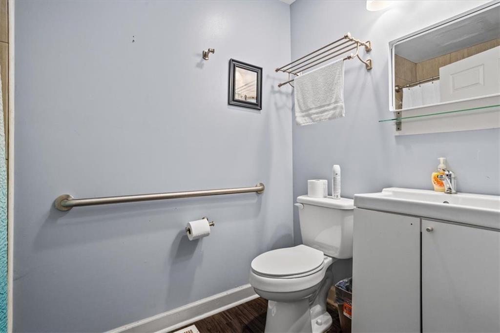 475 Newton Bridge Road Athens, GA 30607 - Photo 27 of 44 a white toilet sitting next to a bathroom sink