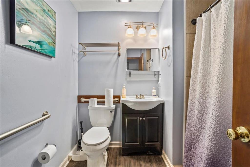 475 Newton Bridge Road Athens, GA 30607 - Photo 30 of 44 a bathroom with a toilet sink and mirror