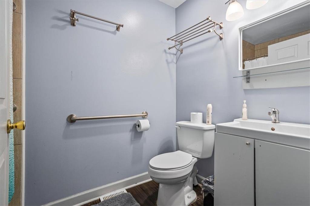 475 Newton Bridge Road Athens, GA 30607 - Photo 32 of 44 a bathroom with a toilet sink and mirror