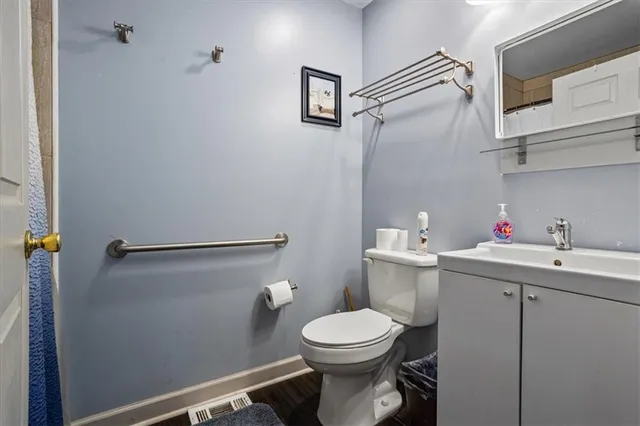 a bedroom with a bed and a chair