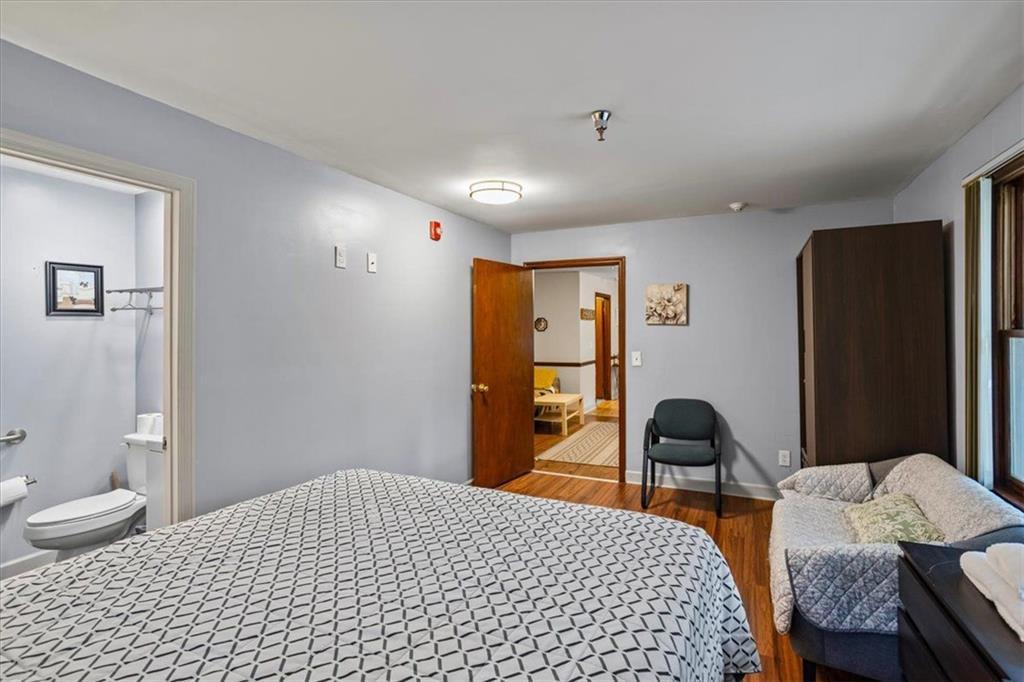 475 Newton Bridge Road Athens, GA 30607 - Photo 36 of 44 a bedroom with a bed and a chair