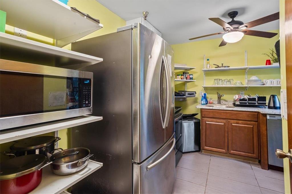 475 Newton Bridge Road Athens, GA 30607 - Photo 39 of 44 a kitchen with stainless steel appliances granite countertop a refrigerator and a stove