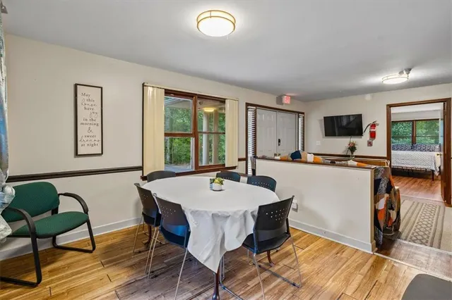 a view of a dining room with furniture window and outside view