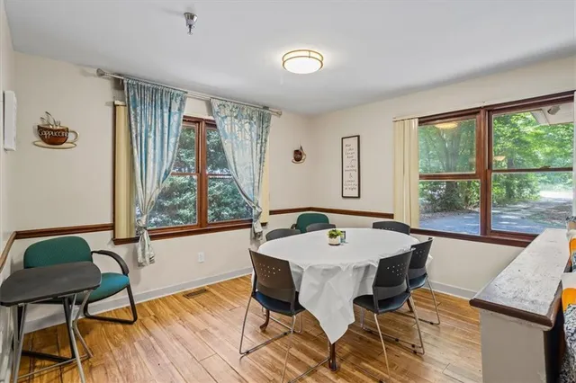a living room with furniture a rug and a window