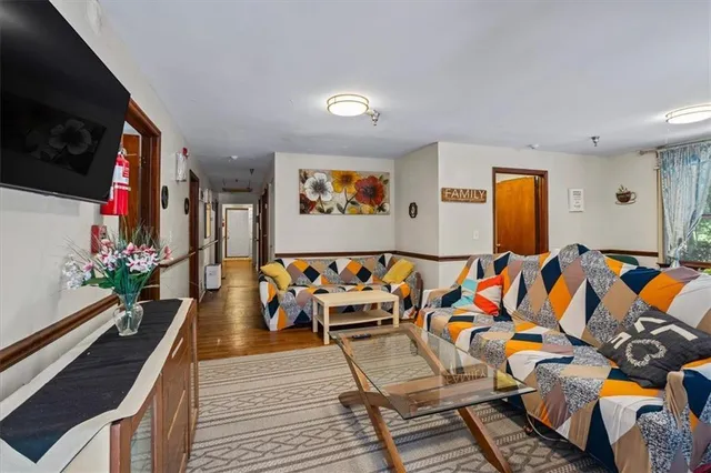 a front view of a house with a garden