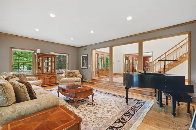a view of a dining room with furniture and chandelier